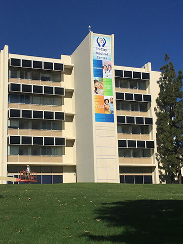 Building mural wrap on a tower exterior