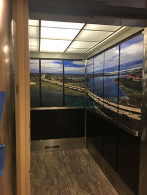 Beach scene elevator wrap in an office building