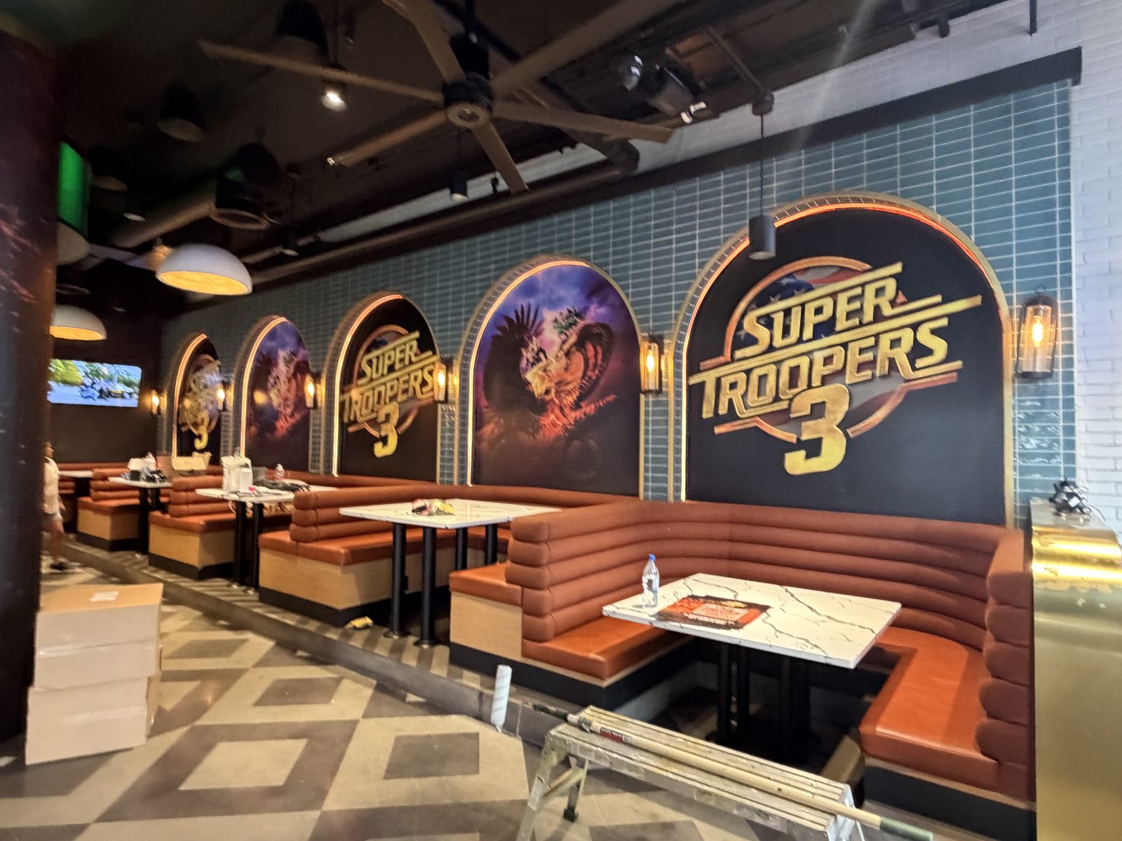 Custom arched wall graphics inside the Super Troopers 3 Comic-Con activation